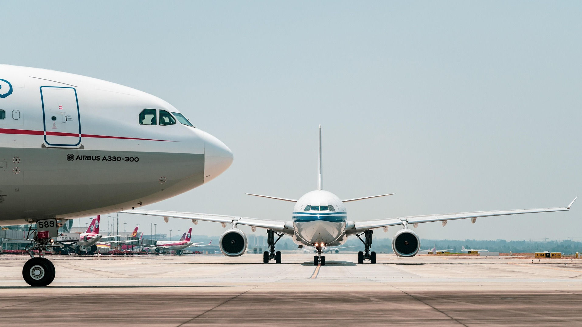 Airplane Taxiing Down Runway 