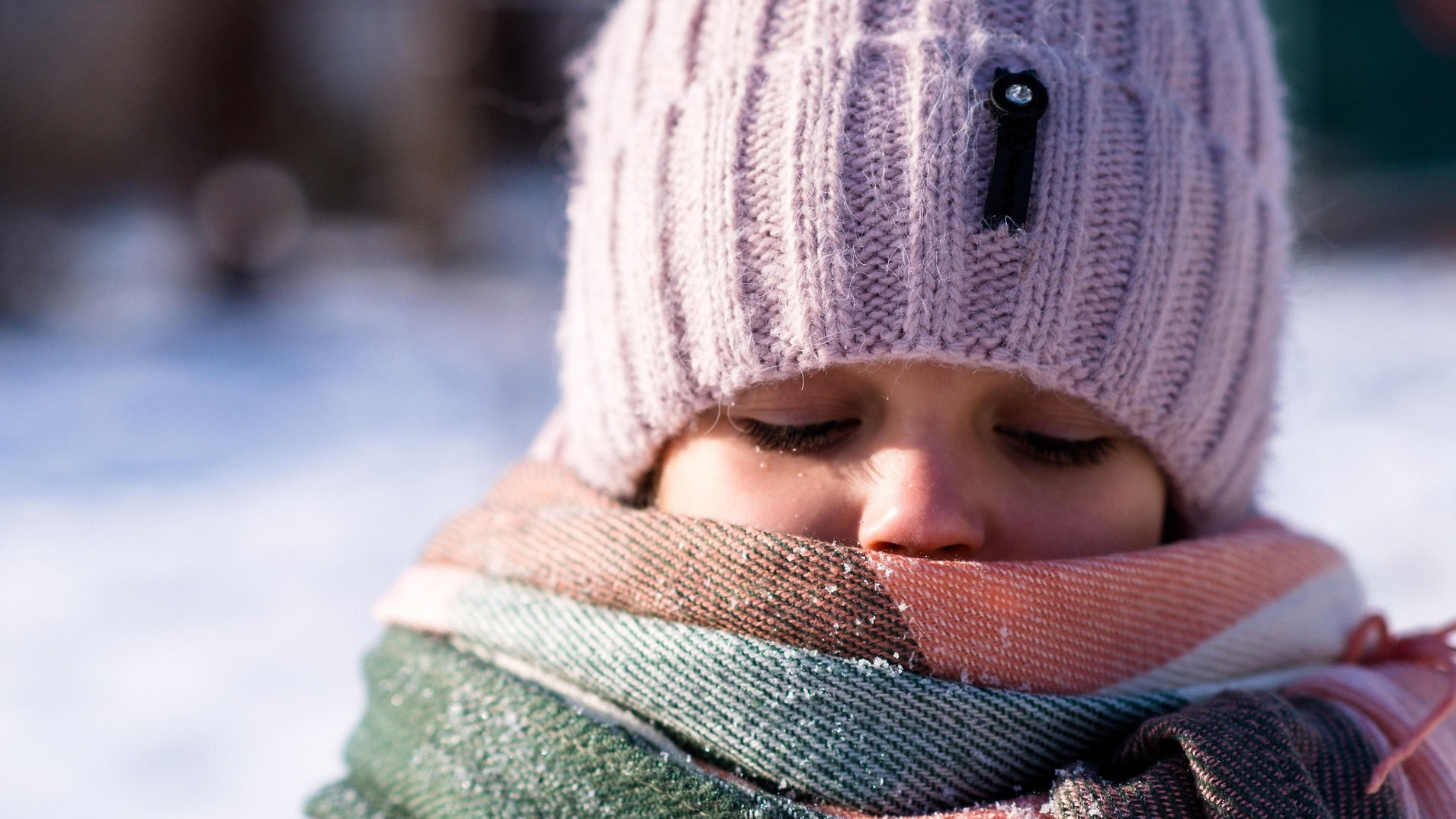 Child with a scarf around throat